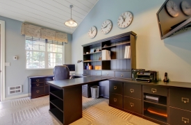 Blue modern home office interior design with dark brown furnitur